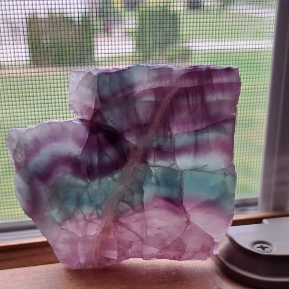Raw flourite shaped like WA